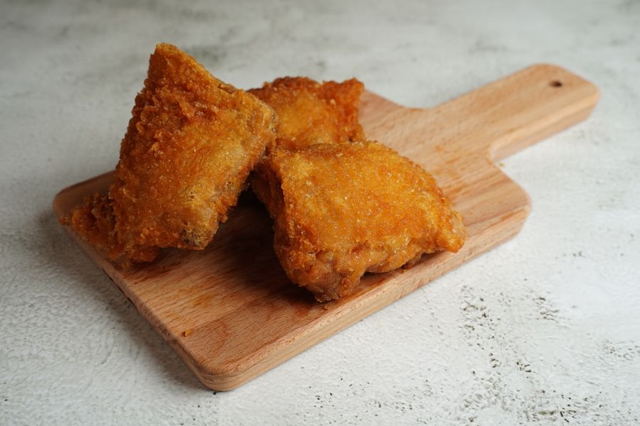 King Wing crispy fried chicken on a wooden board
